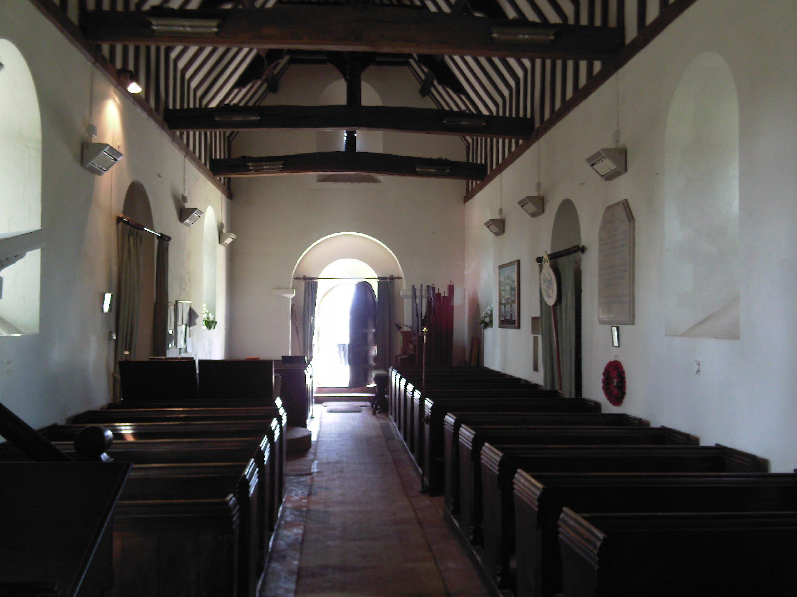 Church pews beams white walls