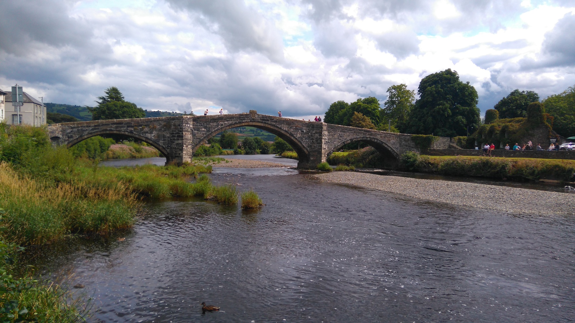 A historic stone bridge across the River Conwy at Llanrwst.