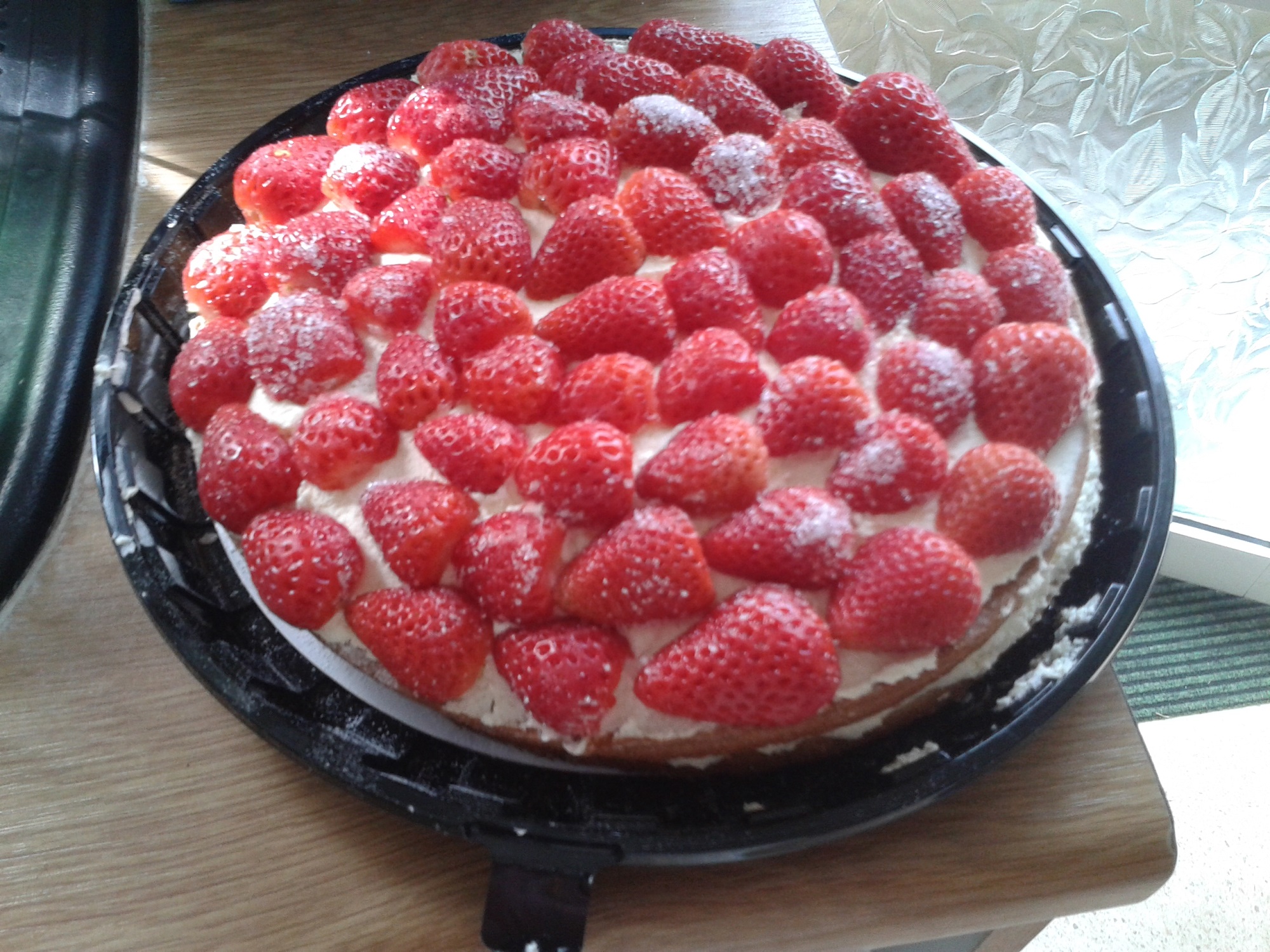 Strawberry trifle, sporting numerous lovely strawberries